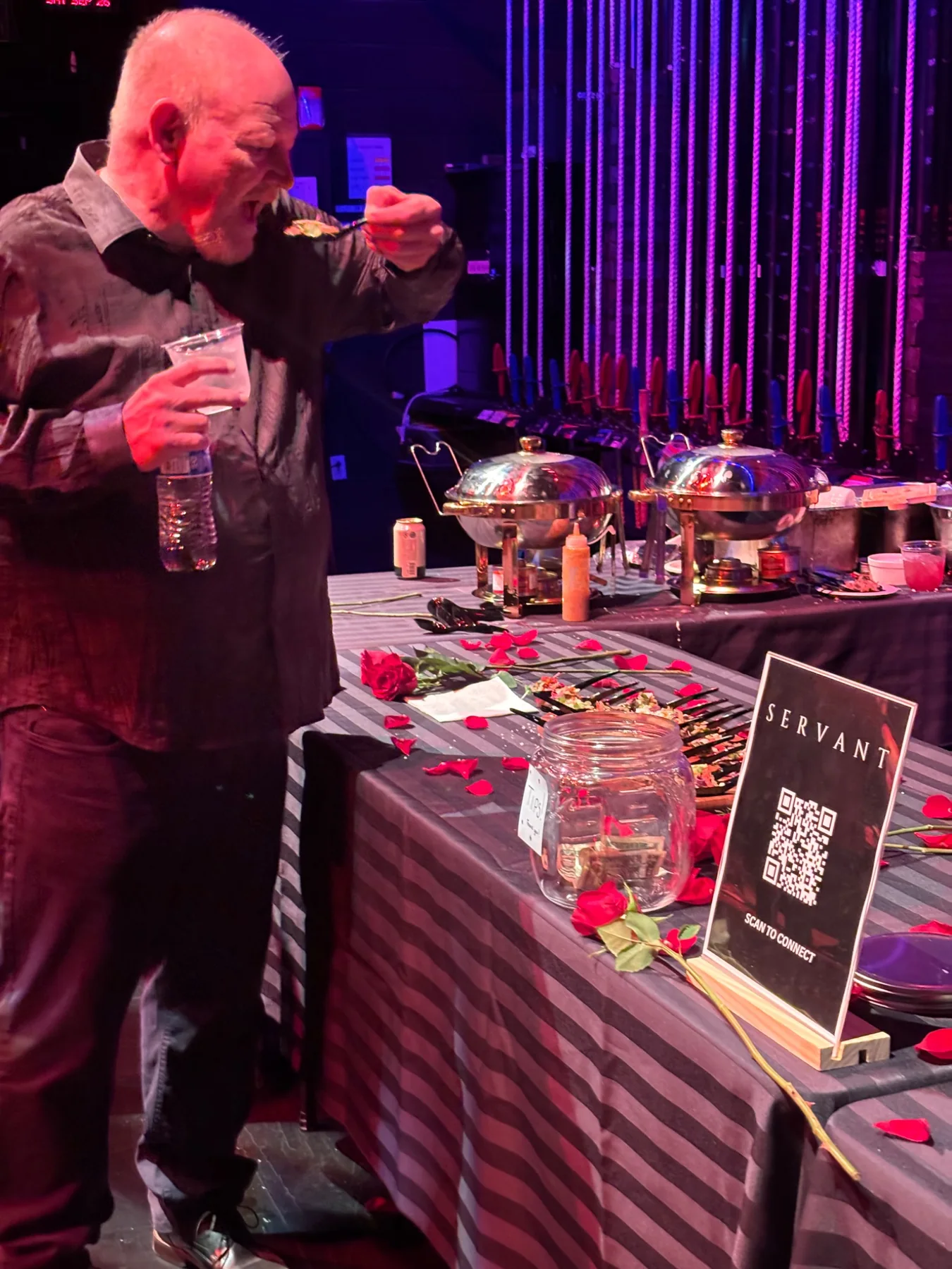 Guest enjoying SERVANT hors d'oeuvres
